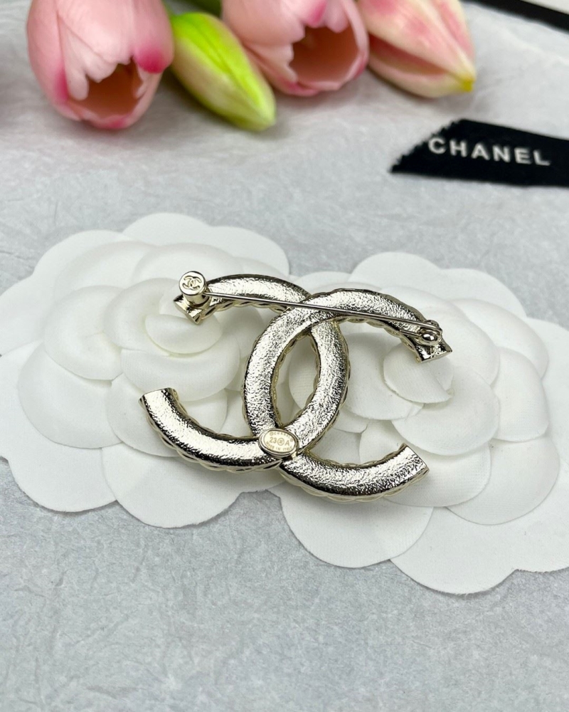 Ch**el brooches